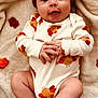 Peyton joined the competition — help win amazing prizes! baby, infant, smiling, hat, onesie, turkey_pattern, hands, feet, blanket, autumn_leaves, cozy, cute, lying_down, indoors, soft_texture, child, happy, portrait, warm_colors, seasonal