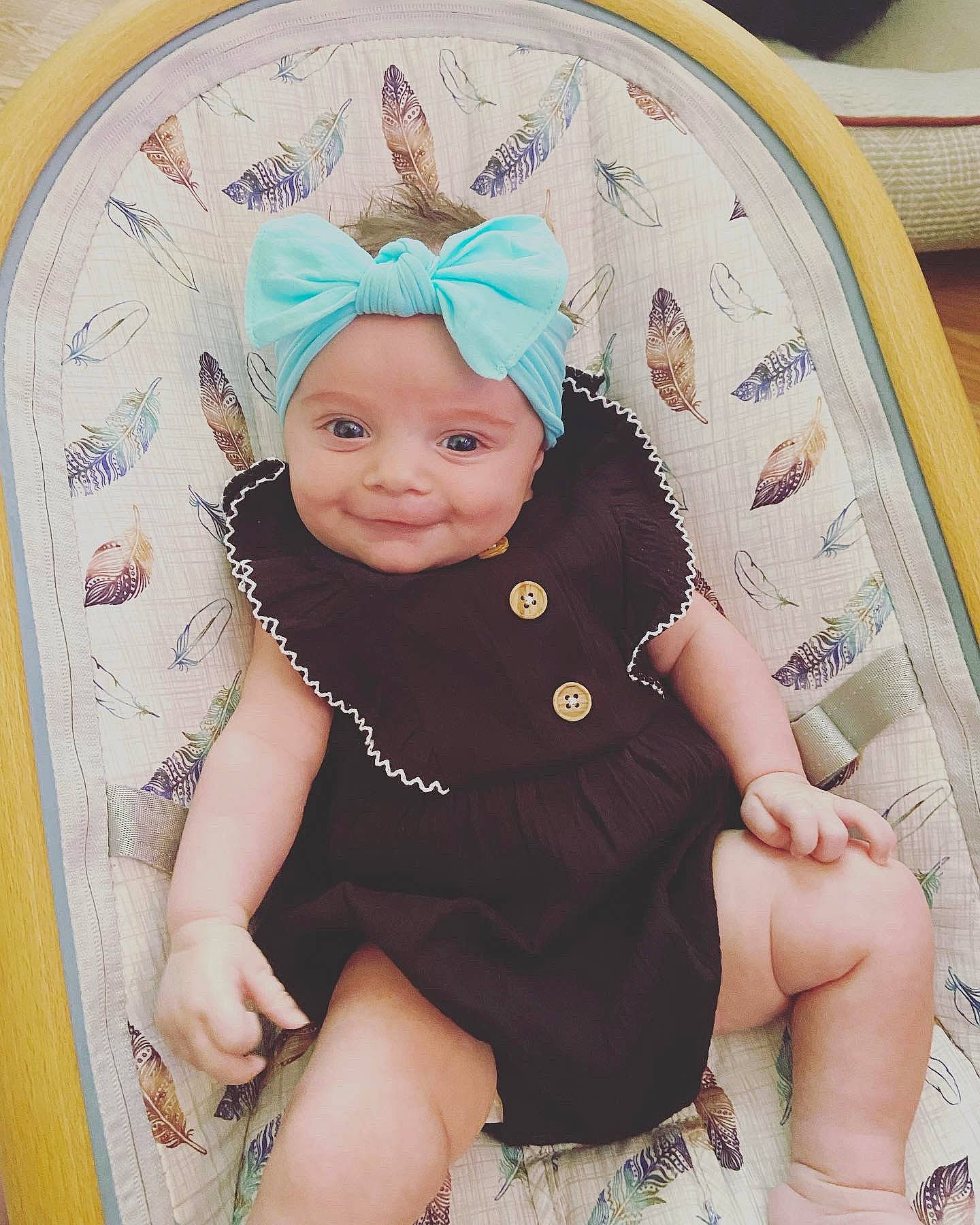 Nova joined the competition — help win amazing prizes! baby, baby_products, baby_toddler_clothing, blond, cap, cheek, child, comfort, happy, headband, headgear, headwear, leg, pattern, person, pink, skin, sleeve, smile, textile