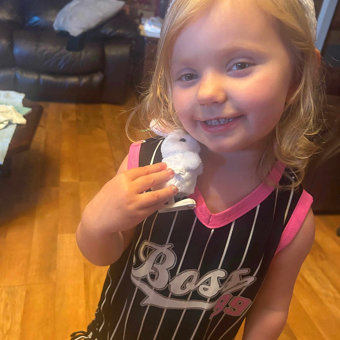 Arrie joined the competition — help win amazing prizes! blonde_hair, bunny_ears, child, clothing, couch, eyes, face, furniture, girl, happy, hardwood_floor, indoor, living_room, pink, plush_toy, portrait, smiling, stripes, toddler, toy