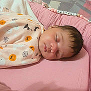 Ariannys is registered to the contest to win money with this photo: newborn, baby, sleeping, infant, face, portrait, blanket, swaddled, pink, crib, bedding, pacifier, necklace, beads, indoors, cozy, peaceful, closed_eyes, baby_hair, nursery