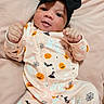 Ariannys joined the competition — help win amazing prizes! baby, infant, child, portrait, lying_down, smiling, thumbs_up, black_bow, headband, halloween, pumpkin, ghosts, bats, spiderwebs, pajamas, pink_clothing, cushion, indoor, close_up, cute