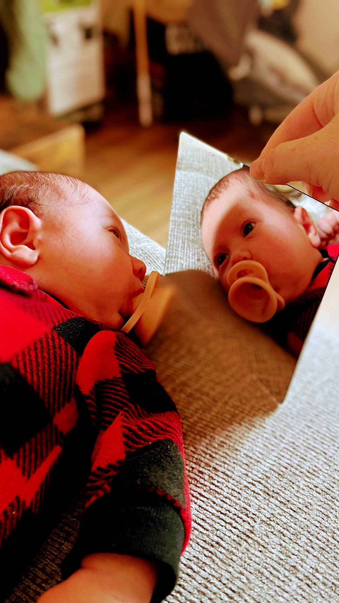 Lydia is registered to the contest to win money with this photo: baby, baby_toddler_clothing, cheek, child, chin, comfort, facial_expression, finger, flooring, fun, happy, hardwood, joint, mammal, mouth, nose, person, room, skin, toddler