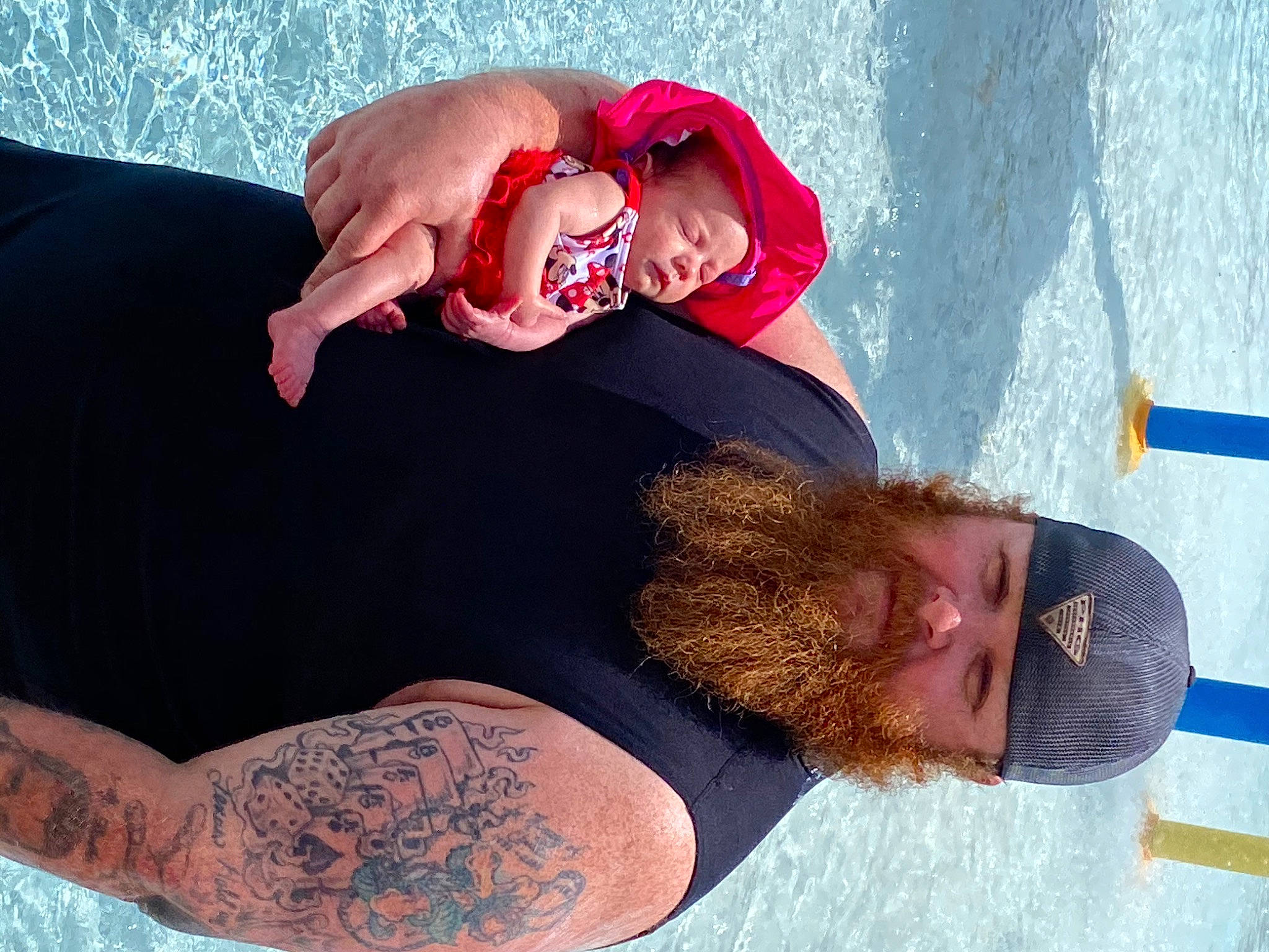 Alaina is registered to the contest to win money with this photo: arm, birth, child, elbow, flesh, fun, hand, headwear, human, muscle, person, tattoo