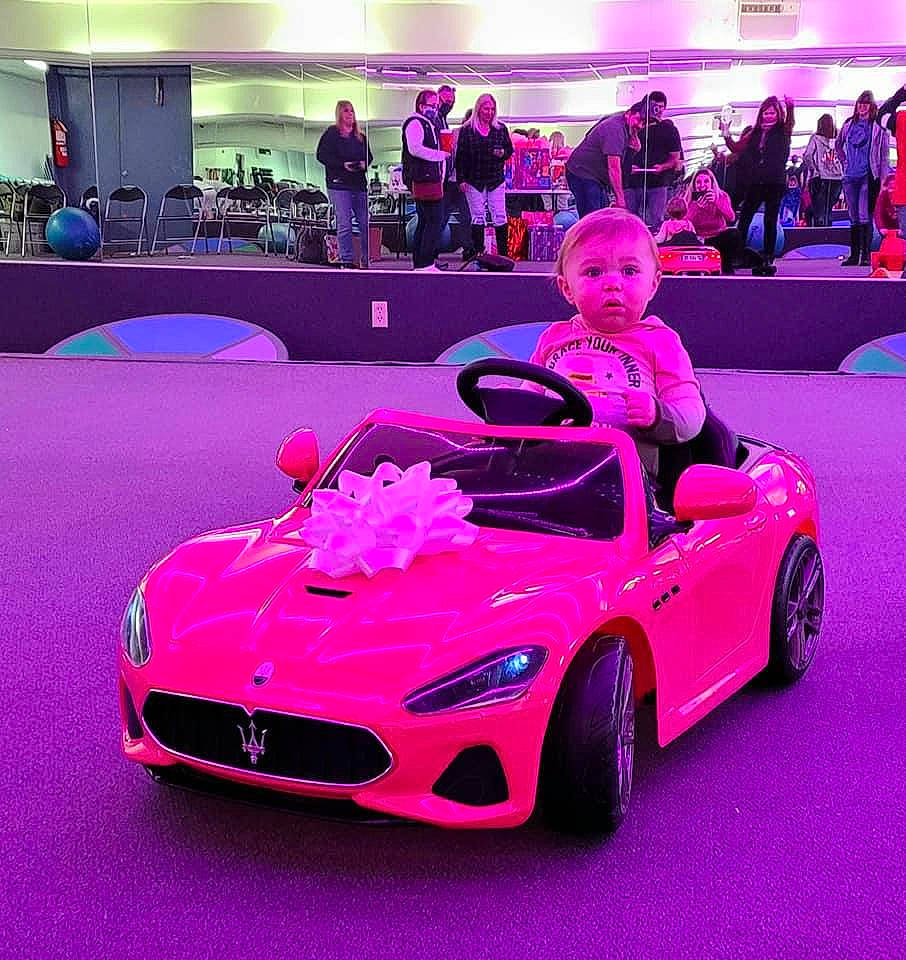 Aria joined the competition — help win amazing prizes! alloy_wheel, automotive_design, automotive_exterior, automotive_lighting, automotive_tire, black, bumper, car, clothing, fender, grille, hood, motor_vehicle, person, photograph, pink, purple, tire, vehicle, wheel