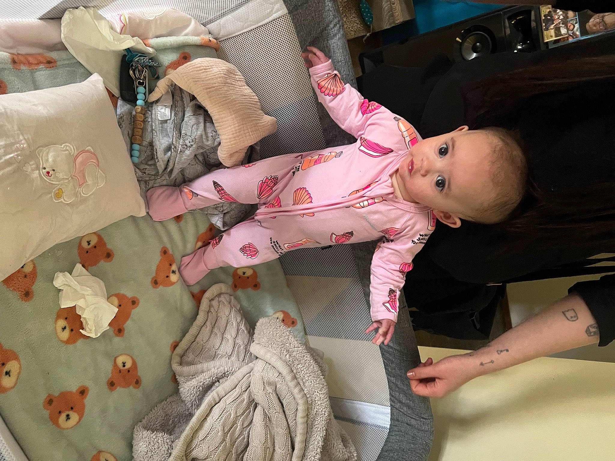 Lucia is registered to the contest to win money with this photo: baby, baby_products, baby_toddler_clothing, child, comfort, couch, dress, fashion, hand, linens, pattern, person, pink, room, sleeve, textile, toddler, toy, tree, white