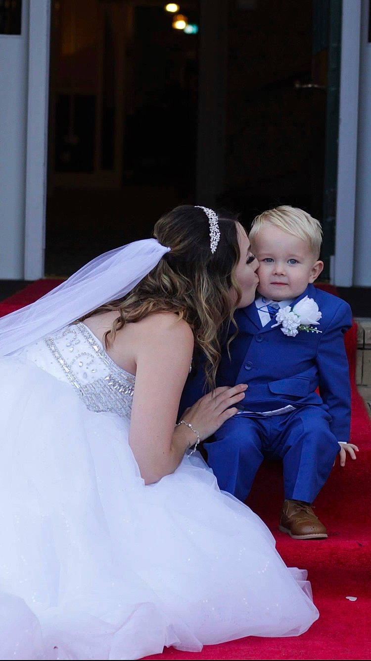 Archie joined the competition — help win amazing prizes! beauty, bridal_clothing, bride, ceremony, child, dress, fun, girl, gown, interaction, lady, people, person, photograph, pink, skin, smile, standing, wedding, wedding_dress