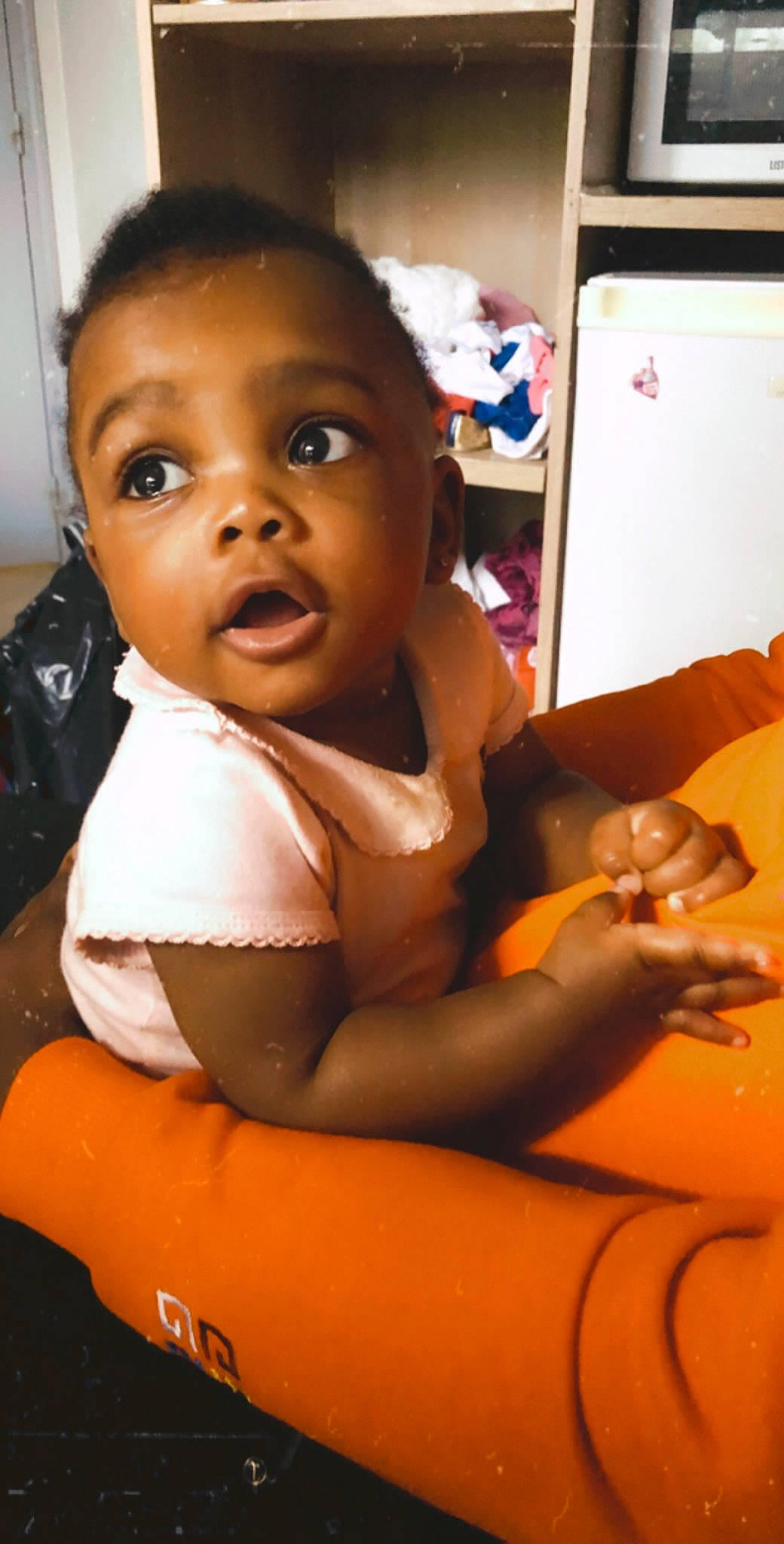 Kheziah participe au concours pour gagner de l'argent avec cette photo : arm, black, black_hair, cheek, child, lip, person, skin, smile, surprise, toddler