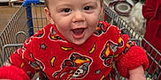 Kaison joined the competition — help win amazing prizes! aisle, baby, child, clothing, cute, face, happy, holiday_decorations, indoor, person, playful, red_onesie, retail, shelves, shopping, shopping_cart, smiling, store, toddler, toys