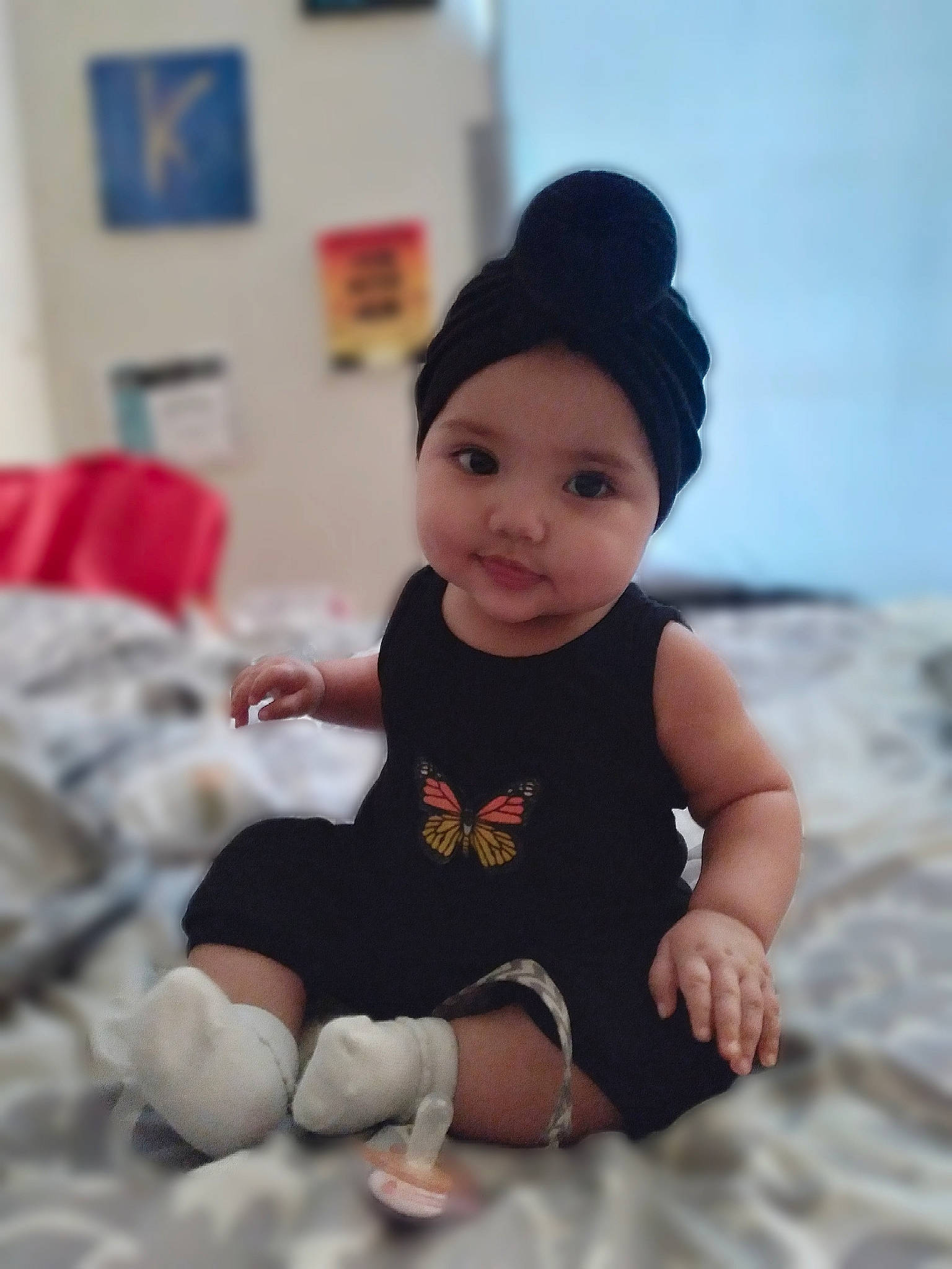 Kalila is registered to the contest to win money with this photo: baby, baby_toddler_clothing, beanie, cap, child, flash_photography, fun, happy, hat, headwear, human_leg, knit_cap, pattern, person, room, sitting, skin, sleeve, t_shirt, thigh