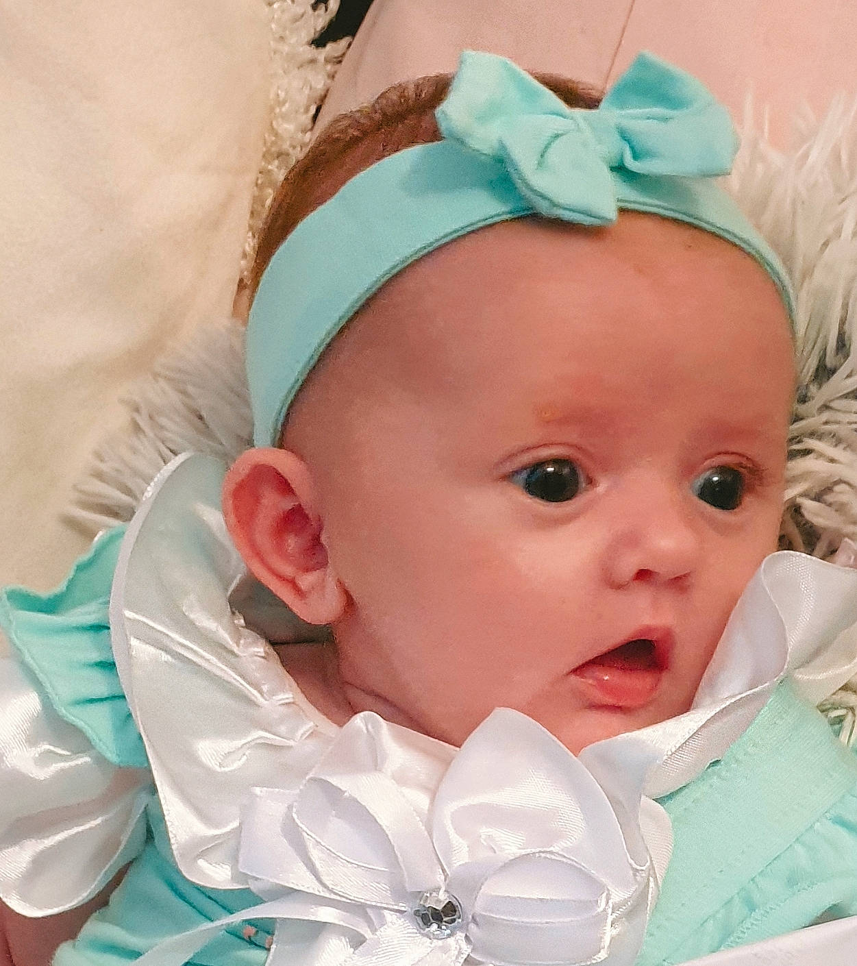 Layla-rose is registered to the contest to win money with this photo: baby, baby_products, baby_toddler_clothing, cheek, child, face, fashion_accessory, forehead, hair_accessory, head, headband, headgear, nose, person, product, surprise, toddler