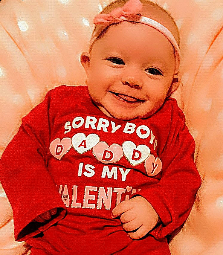 Paisley joined the competition — help win amazing prizes! baby, baby_laughing, baby_toddler_clothing, cap, cheek, finger, font, gesture, happy, headgear, headwear, joy, person, pink, product, red, skin, sleeve, smile, t_shirt
