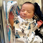 Maximus Anibal is registered to the contest to win money with this photo: newborn, baby, sleeping, infant, onesie, clothing, hospital, bassinet, blanket, towel, peaceful, cute, child, person, face, hand, sleep, rest, soft, newborn_clothing
