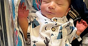 Maximus Anibal is registered to the contest to win money with this photo: baby, bassinet, blanket, child, clothing, cute, face, hand, hospital, infant, newborn, newborn_clothing, onesie, peaceful, person, rest, sleep, sleeping, soft, towel