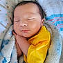 Maximus Anibal joined the competition — help win amazing prizes! baby, sleeping, blanket, yellow_shirt, cozy, closeup, infant, soft_texture, peaceful, child, cute, indoor, wrapped, newborn, portrait, face, resting, comfort, warm, bed