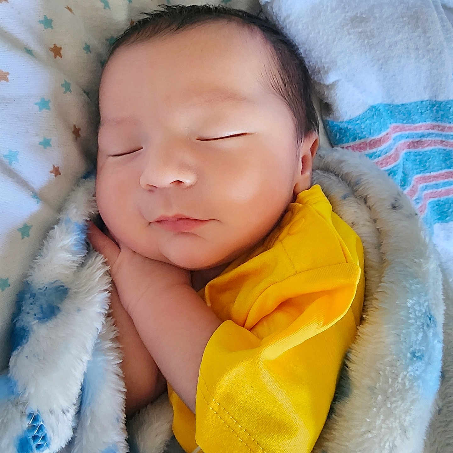 Maximus Anibal joined the competition — help win amazing prizes! baby, bed, blanket, child, closeup, comfort, cozy, cute, face, indoor, infant, newborn, peaceful, portrait, resting, sleeping, soft_texture, warm, wrapped, yellow_shirt