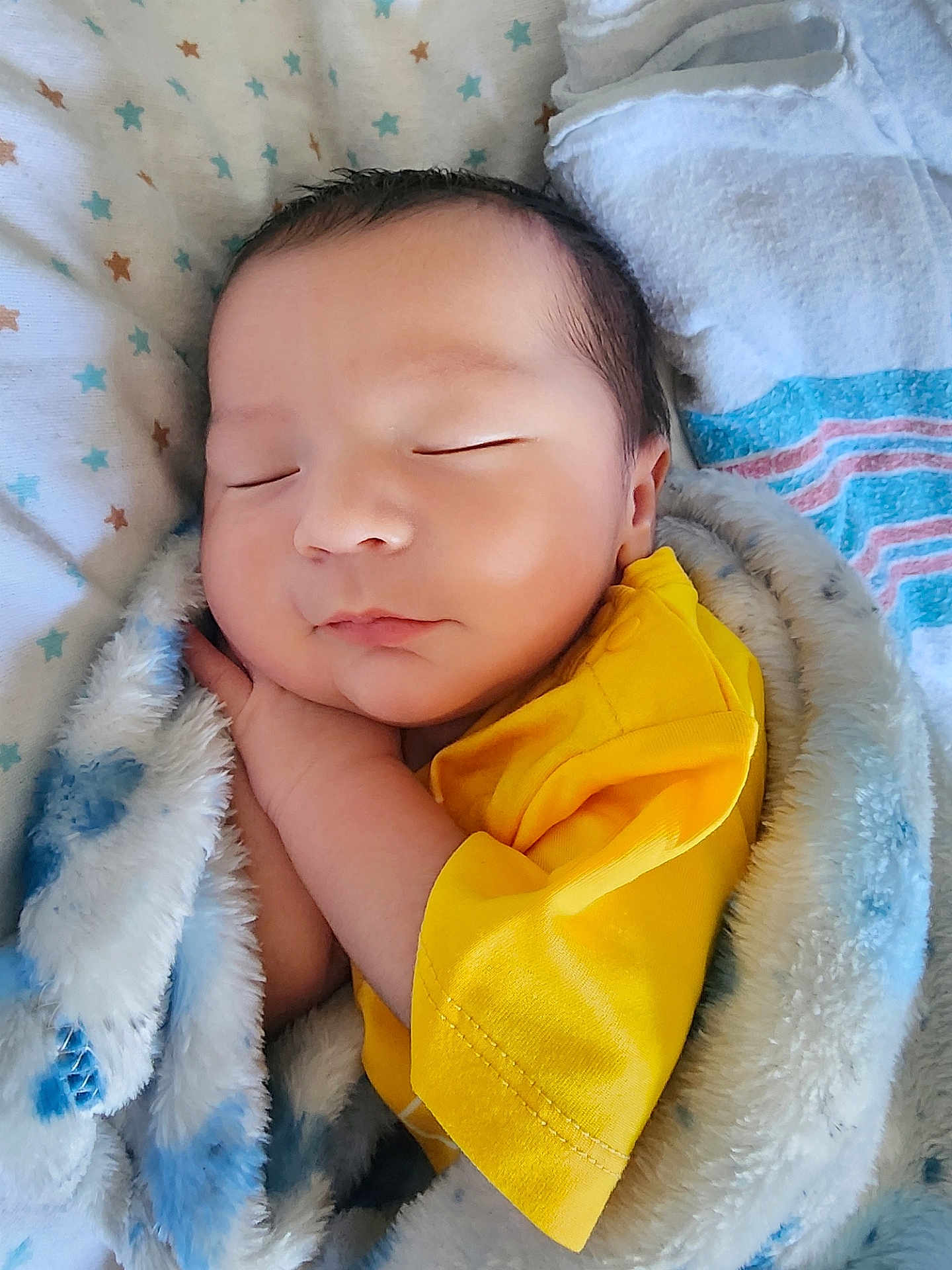 Maximus Anibal joined the competition — help win amazing prizes! baby, sleeping, blanket, yellow_shirt, cozy, closeup, infant, soft_texture, peaceful, child, cute, indoor, wrapped, newborn, portrait, face, resting, comfort, warm, bed