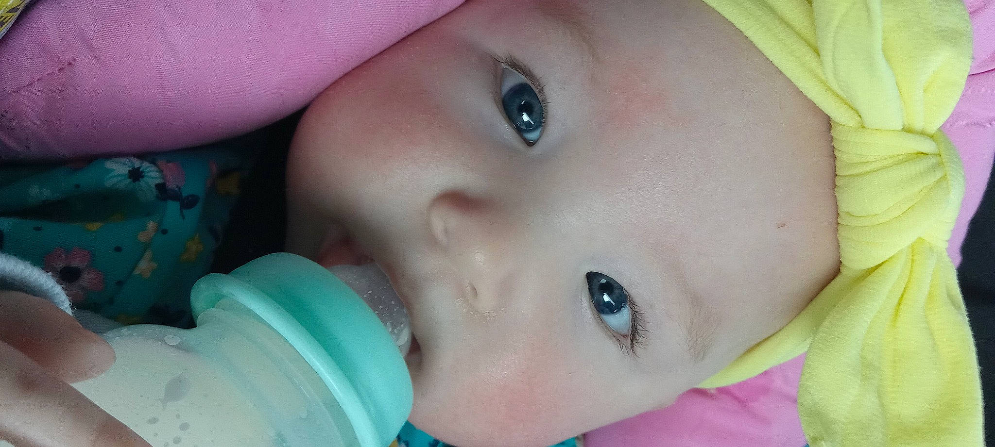 Zaya is registered to the contest to win money with this photo: azure, baby, cheek, chin, eye, eyebrow, eyelash, finger, forehead, hair, happy, headgear, human_body, iris, lip, mouth, nose, person, pink, skin