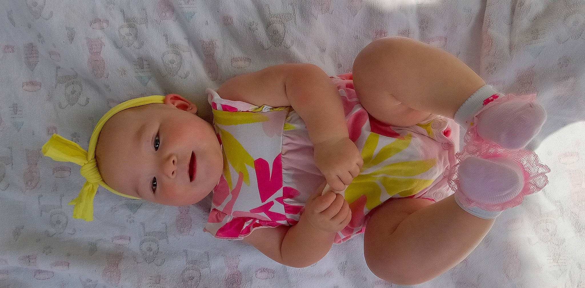 Zaya is registered to the contest to win money with this photo: baby, baby_products, baby_toddler_clothing, brassiere, cheek, chest, child, comfort, finger, hand, happy, human_body, human_leg, pattern, person, pink, product, skin, textile, thigh