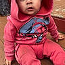 toddler, child, baby, portrait, sitting, pink_hoodie, hooded_sweatshirt, spiderman, superhero, wide_eyes, surprised, face, dark_hair, outdoor, porch, wooden_deck, house, casual_clothing, shoes, candid_photography