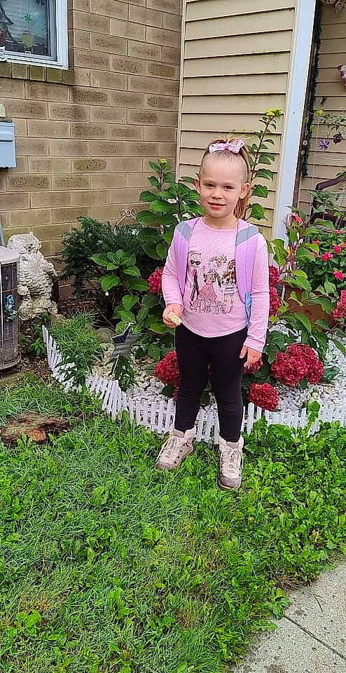 Naomi joined the competition — help win amazing prizes! annual_plant, flower, garden, grass, groundcover, house, joy, landscaping, lawn, magenta, pattern, people_in_nature, person, plant, shrub, sleeve, soil, sportswear, street_fashion, t_shirt