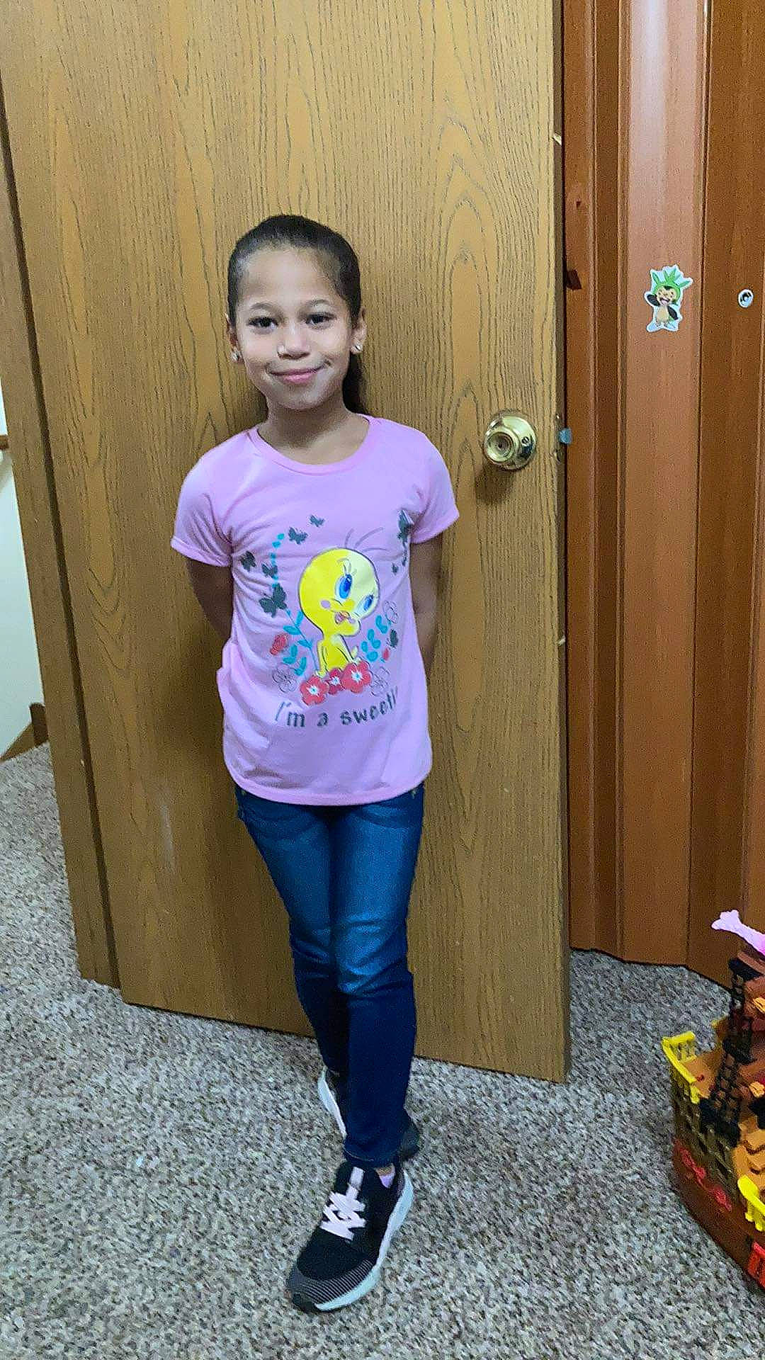 Kaylianie is registered to the contest to win money with this photo: child, door, electric_blue, fun, human_leg, joint, joy, knee, long_hair, magenta, person, shoe, sleeve, sneakers, sportswear, standing, street_fashion, t_shirt, thigh, waist