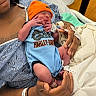 Je'Saiah joined the competition — help win amazing prizes! newborn, baby, infant, hospital, person, hand, clothing, hat, blue, orange, wristband, medical, bed, blanket, skin, holding, child, cute, portrait, resting
