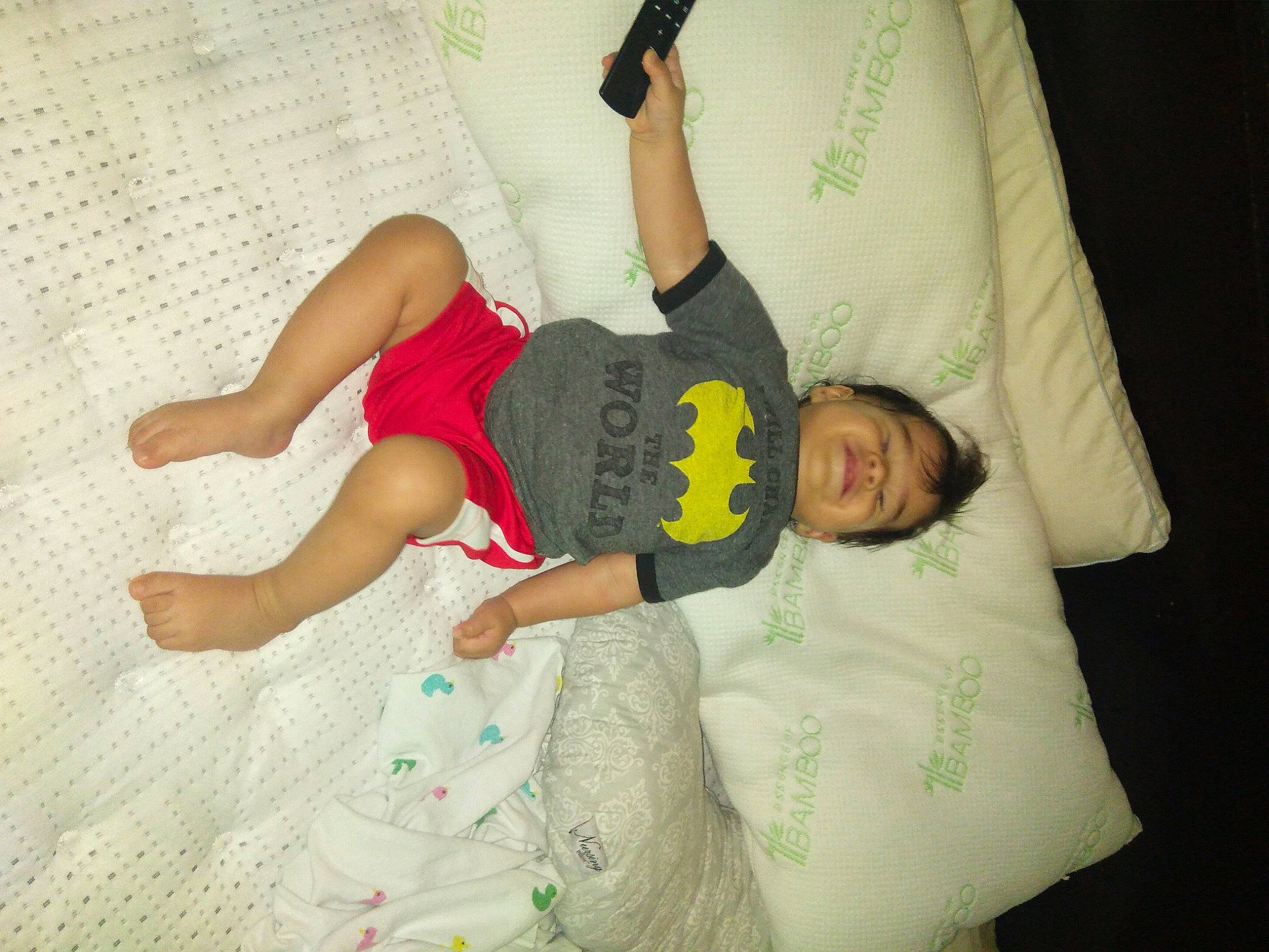 Manuel is registered to the contest to win money with this photo: arm, baby, child, cool, finger, fun, hand, happy, joint, knee, leg, linens, person, play, t_shirt, textile, thigh, toddler, vacation, world