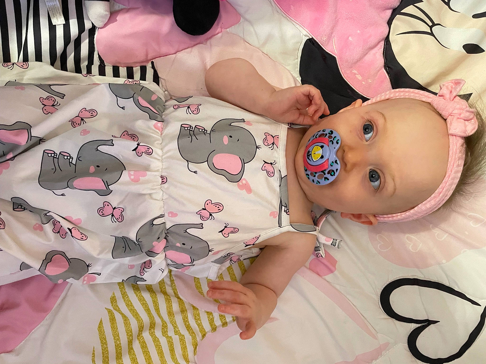 Stormy joined the competition — help win amazing prizes! baby, baby_toddler_clothing, cheek, child, dress, eyelash, fashion_accessory, happy, hat, linens, magenta, pattern, person, pink, product, skin, sleeve, textile, thigh, toddler