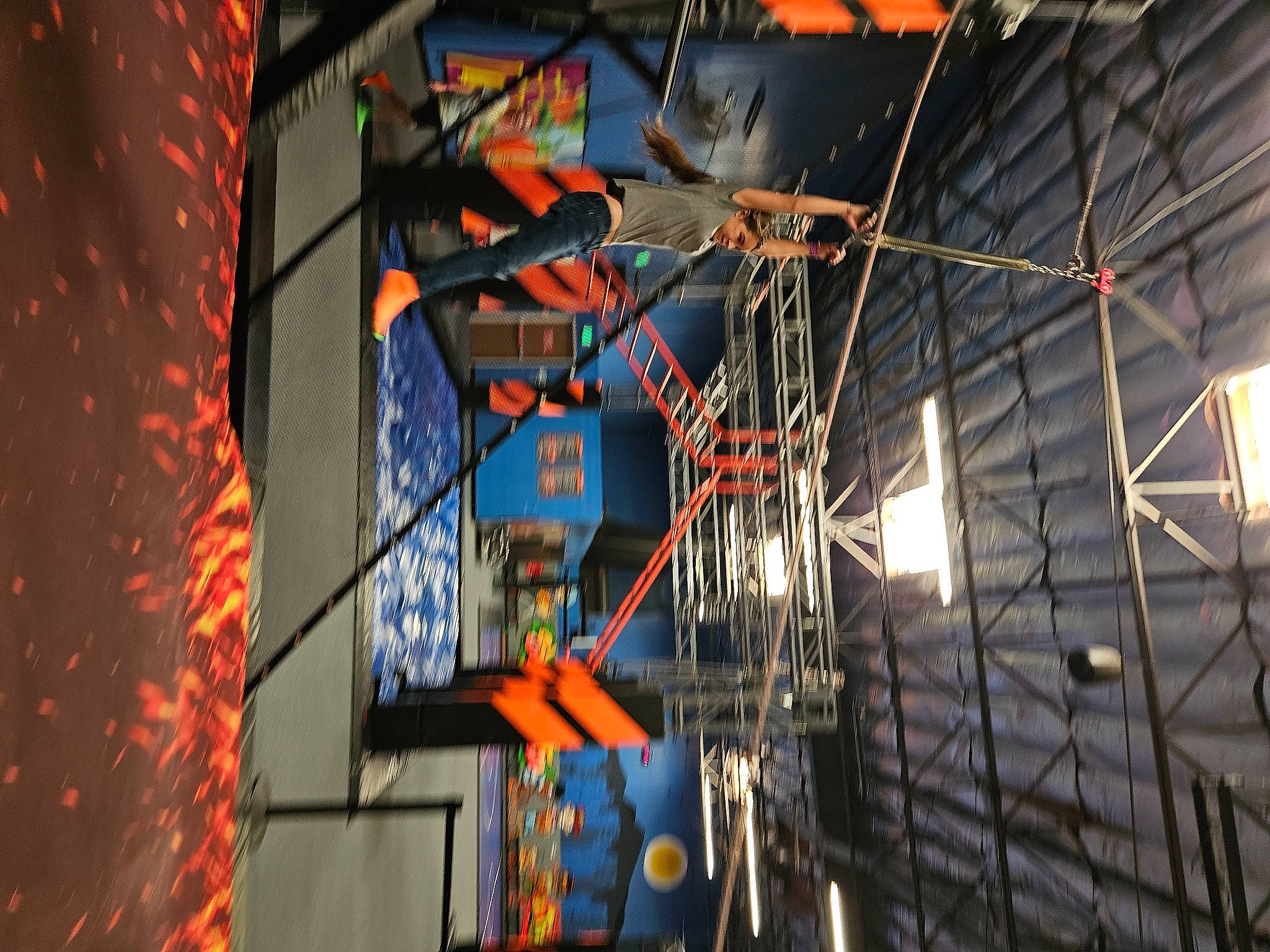 Bailey is registered to the contest to win money with this photo: art, building, ceiling, city, darkness, electric_blue, electricity, engineering, event, facade, glass, metal, metropolitan_area, person, reflection, sky, space, symmetry, tower, tree