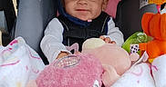 Amarah Love Saunders is registered to the contest to win money with this photo: baby, blanket, car_seat, child, colorful, comfort, cute, happy, headband, indoors, infant, person, pink, plush_toy, portrait, seat_belt, smile, soft, toy, white