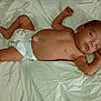 Amarah Love Saunders is registered to the contest to win money with this photo: baby, sleeping, diaper, infant, sheet, lying_down, peaceful, child, newborn, skin, arm, face, head, resting, indoors, young, barefoot, cute, human, relaxed