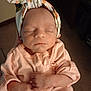 baby, child, closeup, clothing, cozy, cute, flower_pattern, hands, headband, human, indoors, infant, newborn, peaceful, peach_stripes, person, portrait, resting, sleeping, soft_lighting