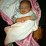 Amarah Love Saunders is registered to the contest to win money with this photo: baby, blanket, sleeping, infant, hands, feet, booties, adult, lap, cozy, soft, pink, white, clothing, person, resting, peaceful, warm, indoor, portrait