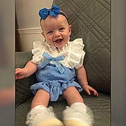 Mila joined the competition — help win amazing prizes! accessories, baby, babylaughing, chair, clothing, couch, cushion, dress, face, furniture, happy, head, homedecor, laughing, pants, person, photography, portrait, sitting, smile