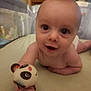 Levi joined the competition — help win amazing prizes! baby, infant, tummy_time, toy, panda, smile, face, hand, cute, child, indoor, bed, playful, young, person, skin, expression, eyes, focus, closeup