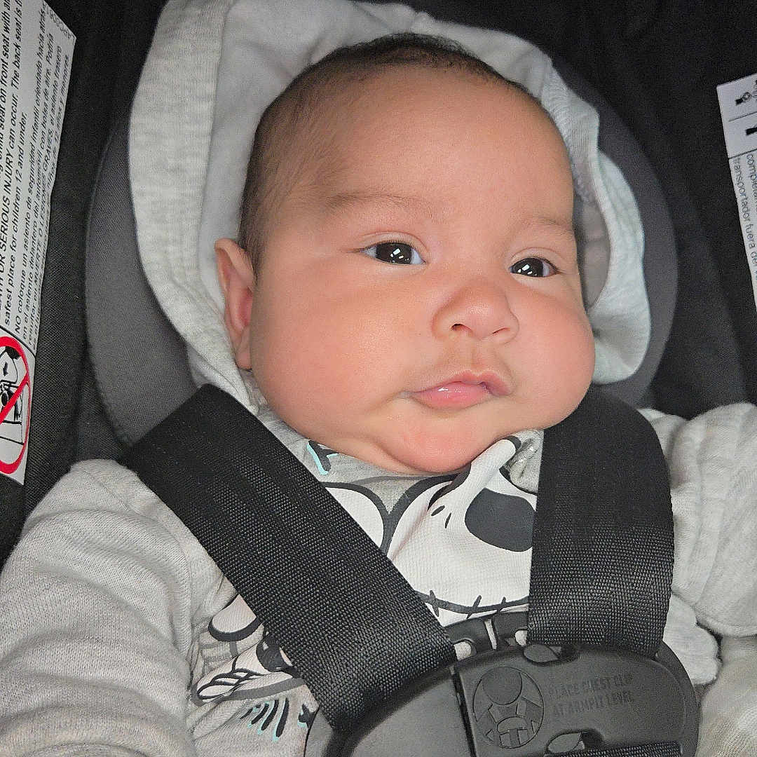 Isaiah joined the competition — help win amazing prizes! accessories, baby, belt, car, car_interior, carseat, clothing, cushion, face, gun, hat, head, homedecor, person, photography, portrait, strap, transportation, vehicle, weapon