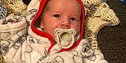 Layton is registered to the contest to win money with this photo: baby, blanket, bonnet, cap, clothing, coat, costume, face, glove, hat, head, homedecor, hood, jacket, newborn, person, photography, portrait, quilt, sleeping