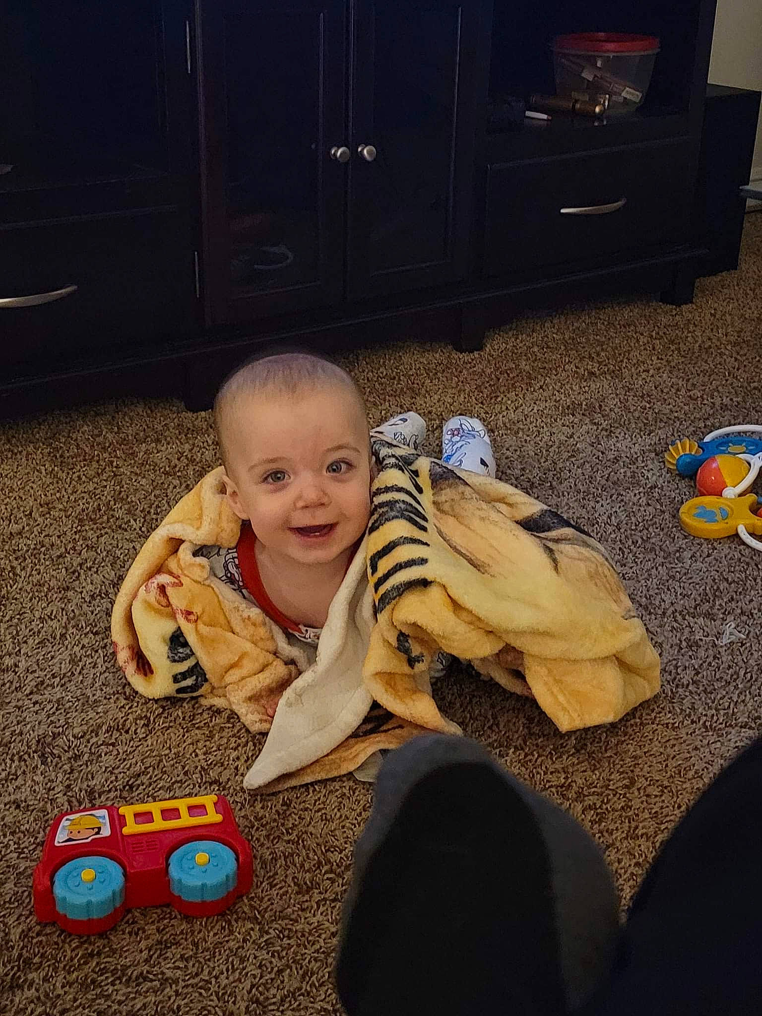 Colt joined the competition — help win amazing prizes! baby, cabinetry, child, comfort, floor, flooring, fun, happy, joy, lap, people, person, play, room, sitting, smile, space, stuffed_toy, television, toddler