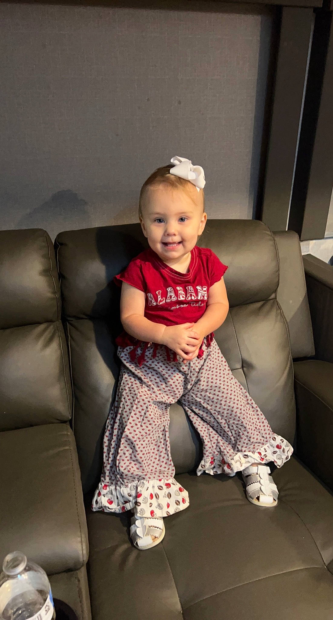 Peyton Mabel joined the competition — help win amazing prizes! baby_toddler_clothing, comfort, couch, event, face, flash_photography, flooring, fun, happy, human_body, human_leg, joy, knee, lap, living_room, person, sandal, sitting, smile, sock