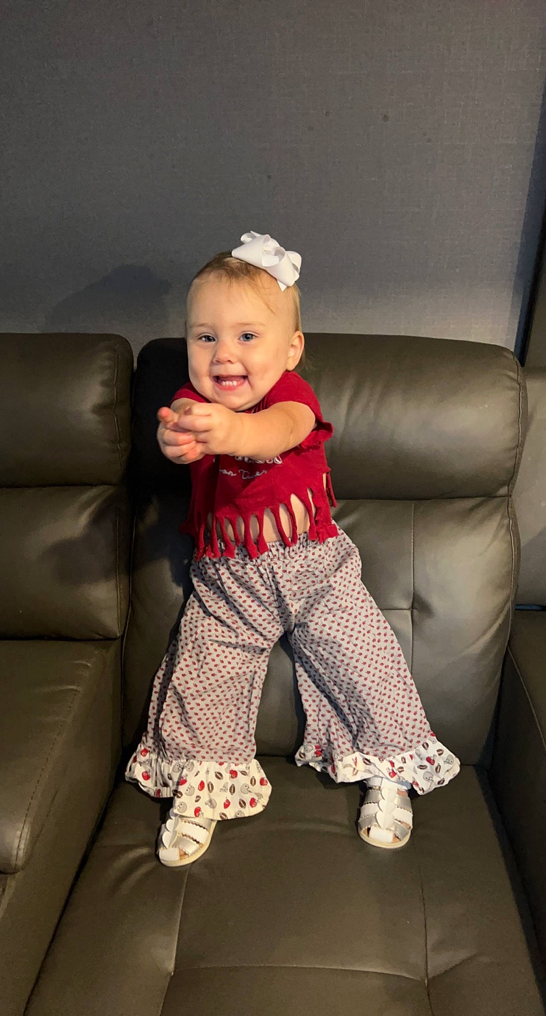Peyton Mabel joined the competition — help win amazing prizes! baby, baby_toddler_clothing, comfort, couch, eyewear, flash_photography, foot, hairstyle, happy, human_body, human_leg, joy, knee, pattern, person, room, sitting, sleeve, smile, sock