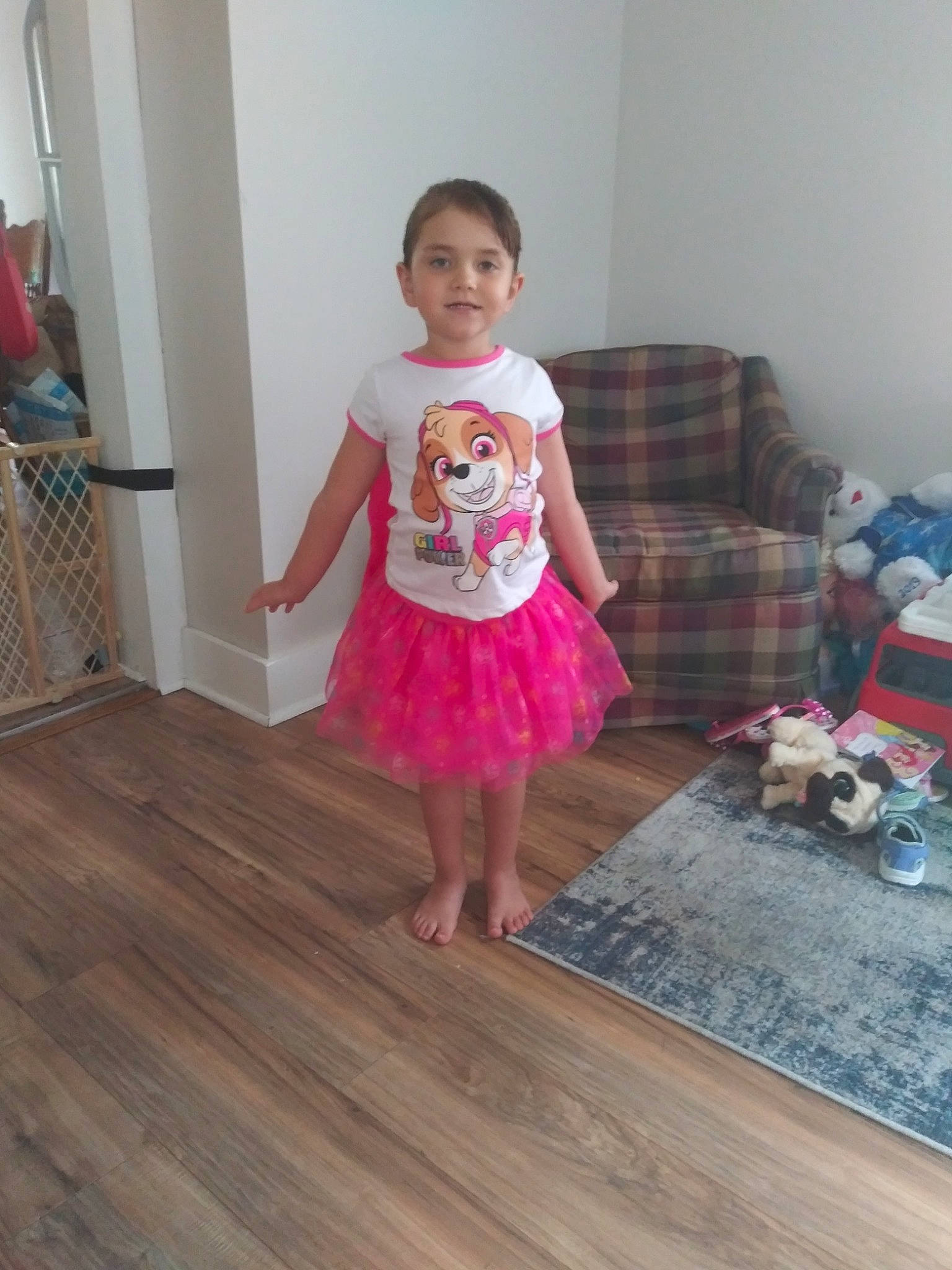 Savannah is registered to the contest to win money with this photo: barefoot, child, couch, floor, flooring, fun, hardwood, human_leg, joy, laminate_flooring, magenta, pattern, person, plank, room, toddler, trunk, varnish, waist, wood