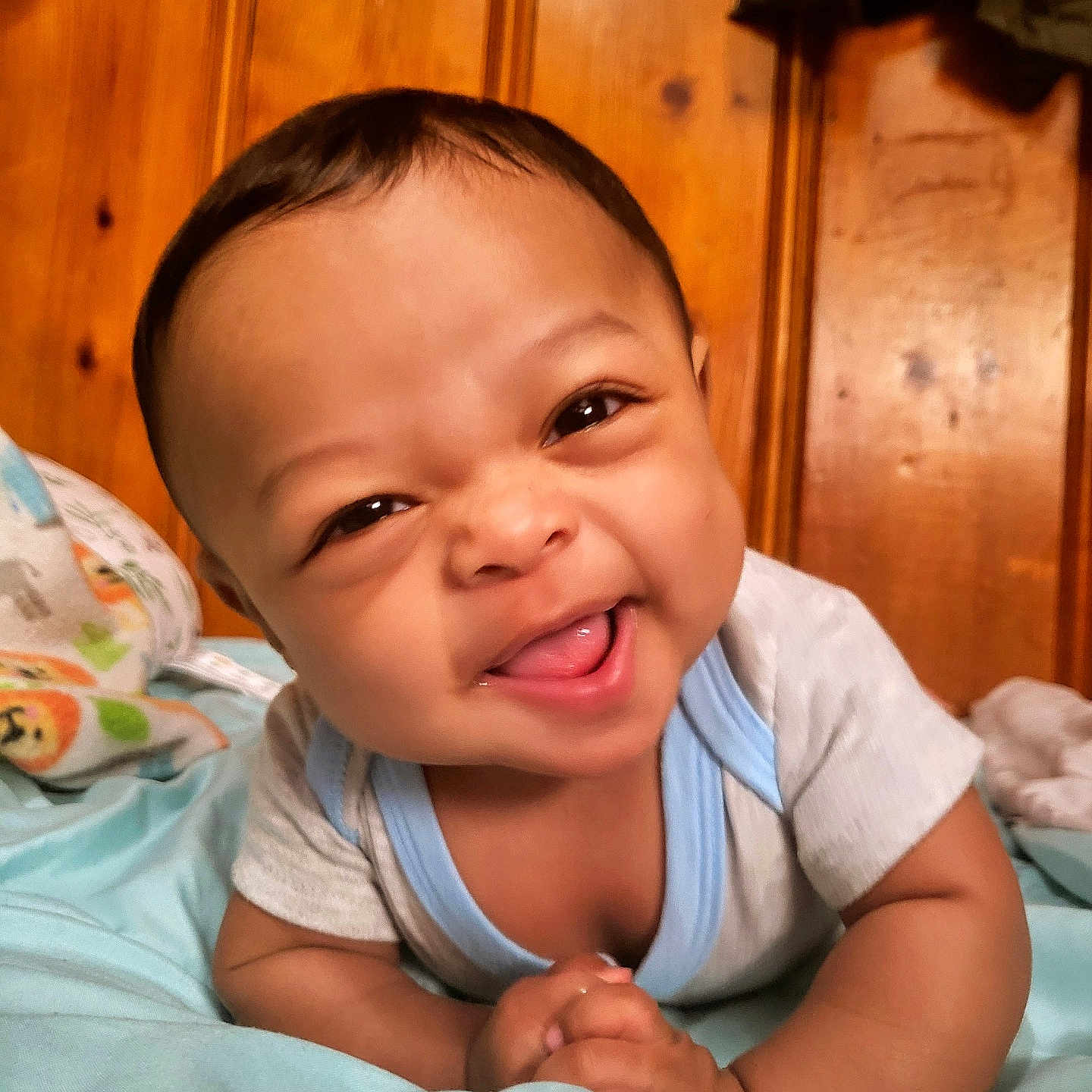 Tayden joined the competition — help win amazing prizes! baby, babylaughing, bed, bedroom, bodypart, face, finger, furniture, hand, happy, head, indoors, laughing, newborn, person, photography, portrait, room, smile, wood