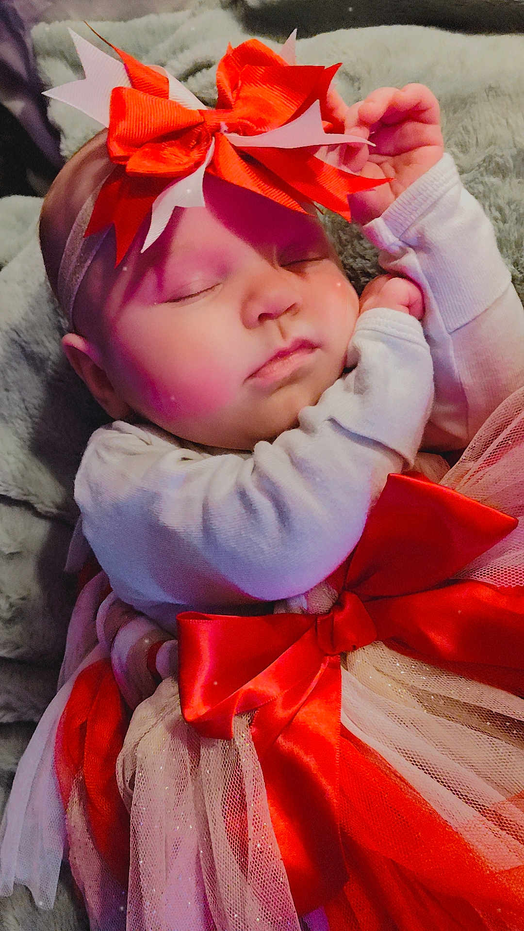 Aurelia joined the competition — help win amazing prizes! baby, sleeping, bow, headband, red_bow, dress, tulle, blanket, cute, infant, adorable, peaceful, child, soft_texture, pink_tint, hands, closed_eyes, portrait, holiday, festive