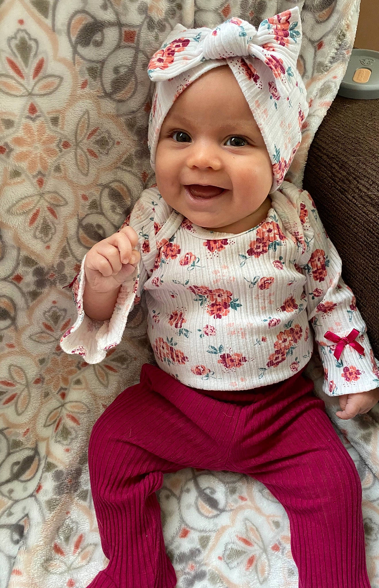 Mitzi joined the competition — help win amazing prizes! baby, baby_products, baby_toddler_clothing, cheek, child, head, headgear, headwear, joy, outerwear, pattern, person, pink, skin, sleeve, smile, textile, toddler