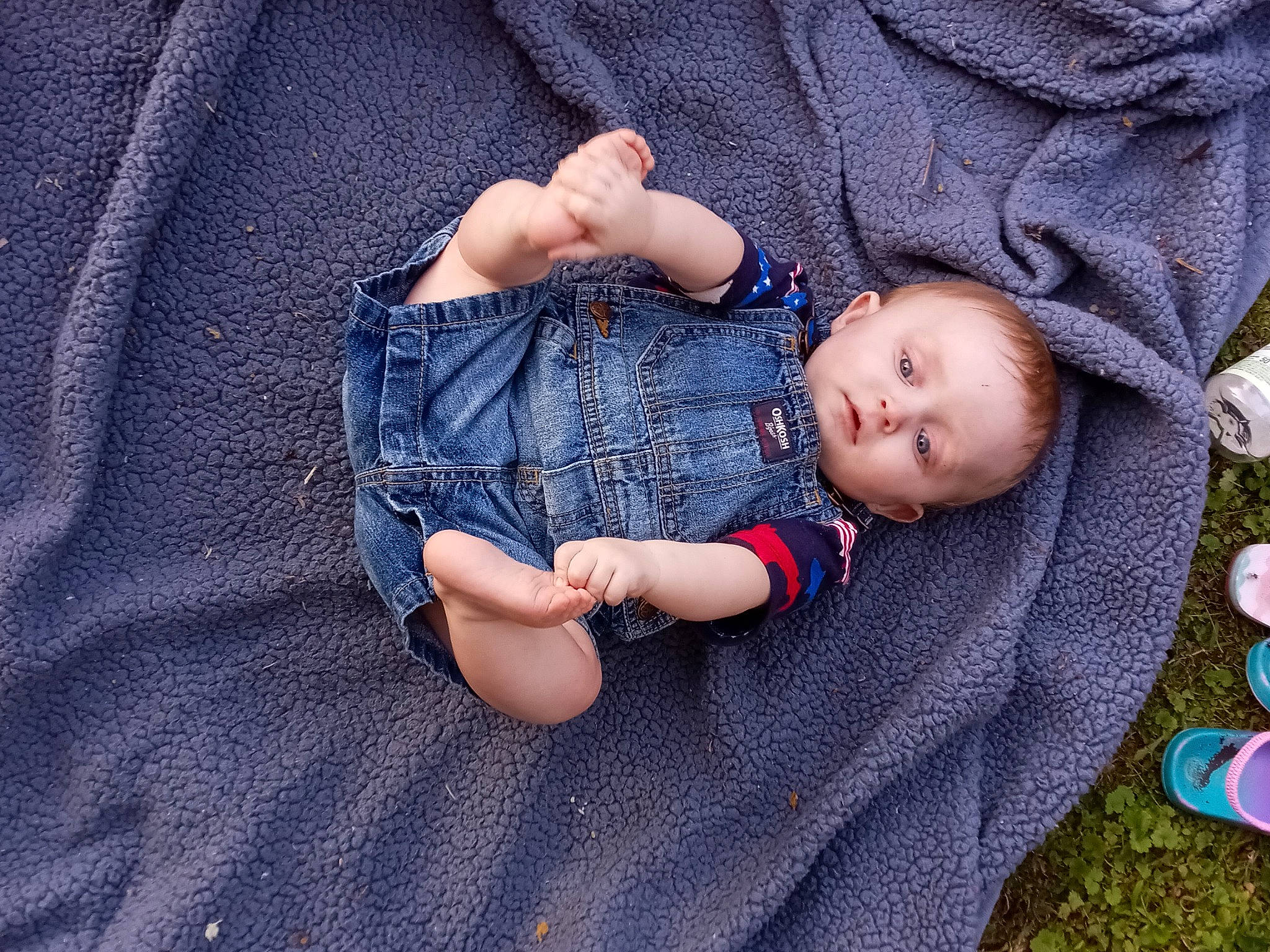 Gregory joined the competition — help win amazing prizes! baby, baby_products, baby_toddler_clothing, child, comfort, denim, electric_blue, gesture, grass, linens, pattern, person, plant, sitting, skin, sleeve, t_shirt, textile, toddler, tree