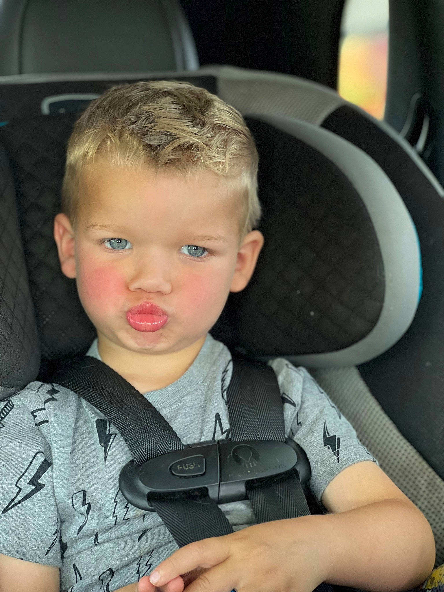 Matthew is registered to the contest to win money with this photo: arm, auto_part, automotive_design, automotive_exterior, car_seat, car_seat_cover, chair, family_car, gesture, hairstyle, head_restraint, luxury_vehicle, motor_vehicle, person, personal_luxury_car, sitting, steering_wheel, t_shirt, thumb, toddler