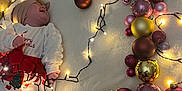 Nelya participe au concours pour gagner de l'argent avec cette photo : baby, christmas, festive, lights, wreath, baubles, blanket, holiday, decorations, soft, smiling, headband, indoors, celebration, cute, child, person, warm, cozy, white