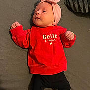 Nelya a rejoint le concours — aidez-le/la à gagner de superbes lots ! baby, infant, red_sweater, pink_headband, black_pants, red_booties, lying_down, face, expression, blanket, soft_surface, cute, clothing, child, portrait, indoors, headwear, person, small_child, baby_clothes