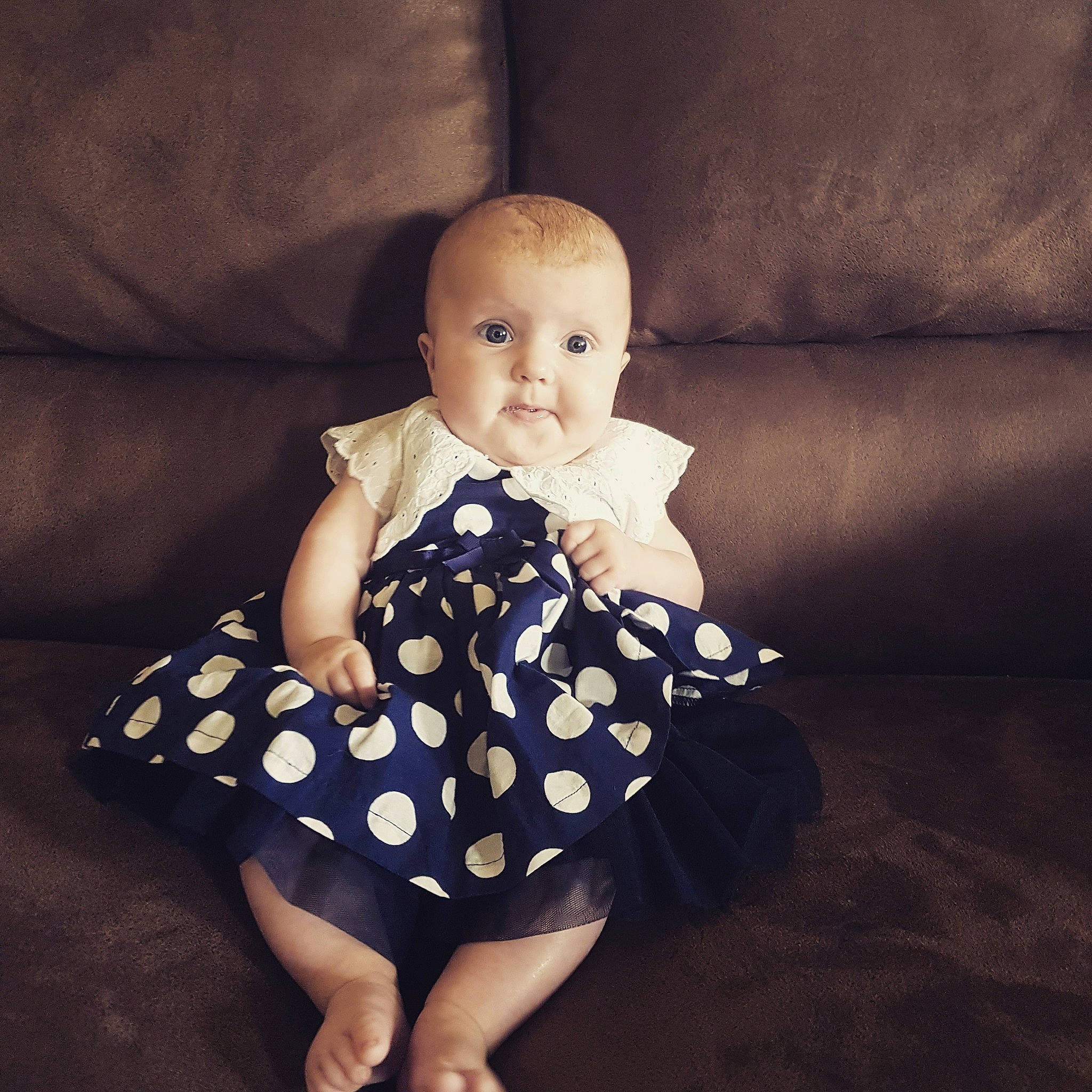 Annie is registered to the contest to win money with this photo: baby, baby_toddler_clothing, child, design, pattern, person, polka_dot, sitting, toddler