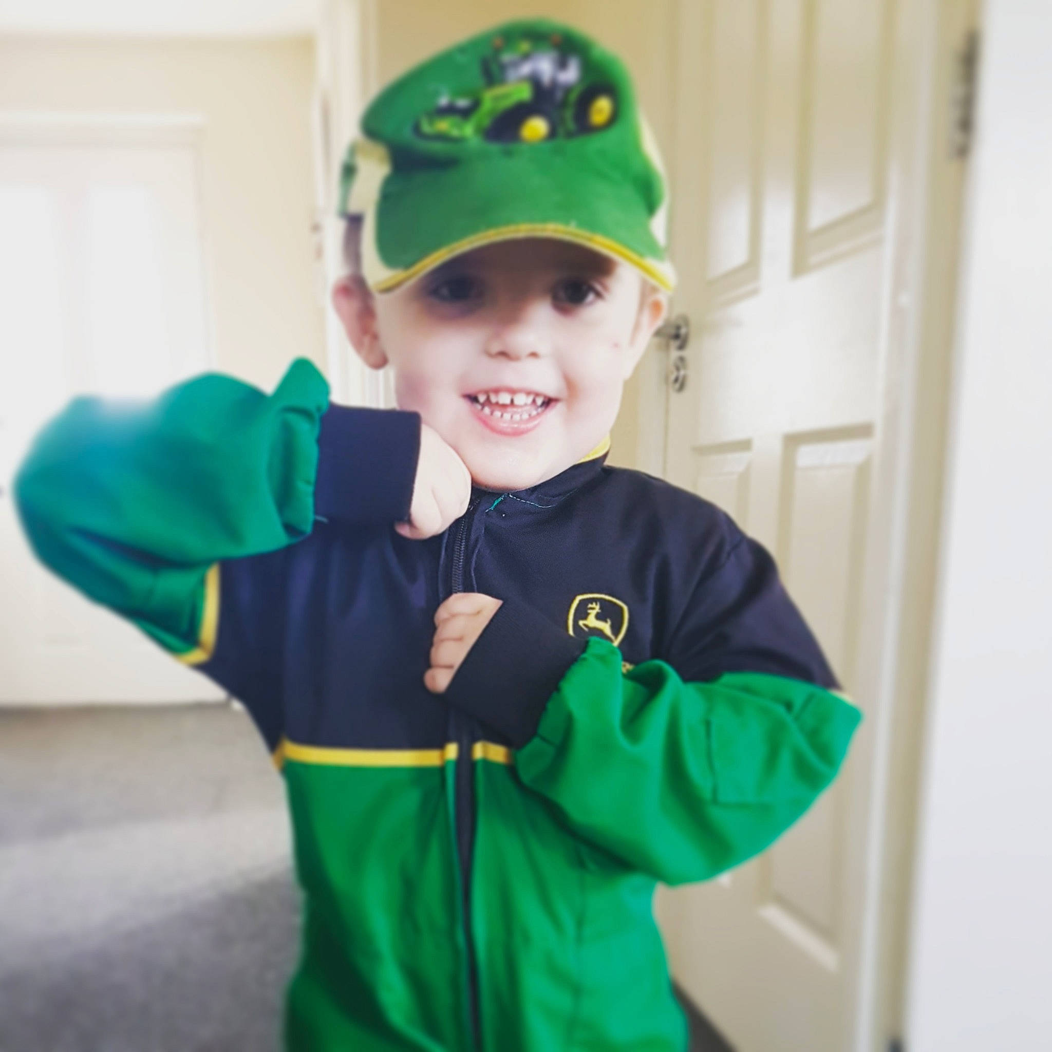 Ernie is registered to the contest to win money with this photo: child, costume, fictional_character, green, hoodie, joy, outerwear, person, saint_patricks_day, sleeve, sports_uniform, sportswear, t_shirt, toddler
